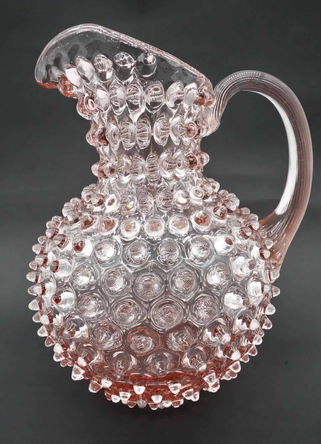 A contemporary Klimchi Rosaline hobnail Art Glass jug. Maker's stamp to the base. H.24cm