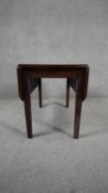 A 19th century mahogany drop flap table on square tapering supports. H.46 W.75 D.61cm