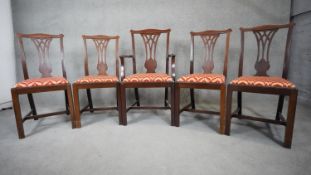 A set of five mahogany Georgian style dining chairs with pierced splats and drop in seats on