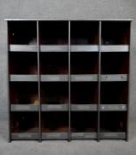 A vintage industrial style metal bank of sixteen pigeon holes. H.92 W.92 D.25cm