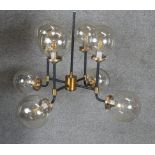 A new in box Mercer glass bubble black And brass chandelier. D.75cm