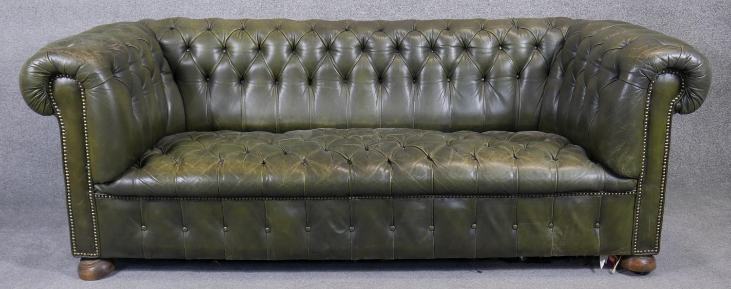 A Chesterfield sofa in leather buttoned upholstery to the seat and back. H.75 W.200 D.90cm