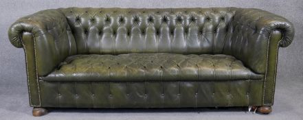 A Chesterfield sofa in leather buttoned upholstery to the seat and back. H.75 W.200 D.90cm
