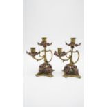 A pair of late 19th century Art Nouveau style brass and copper twin sconce candlesticks with flowing