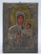A white metal and brass repousse printed oklad religious icon on panel of Mary and Jesus. H.19cm