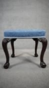 A mahogany mid Georgian style footstool on carved cabriole supports. H.50 W.53 D.43cm