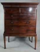 A 19th century mahogany chest on stand with dentil cornice above two short and three long drawers on