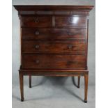 A 19th century mahogany chest on stand with dentil cornice above two short and three long drawers on