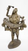 A bronze sculpture of a Tribal Balafon player. H.37 W.20