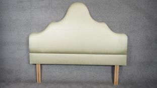 A contemporary arched silk upholstered headboard for a 6ft mattress. H.155 W.182cm