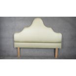 A contemporary arched silk upholstered headboard for a 6ft mattress. H.155 W.182cm