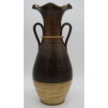 A large art pottery glazed vase with twin handles and fluted edge. H.60cm