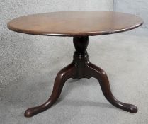 A Georgian mahogany occasional table on tripod cabriole supports. H.45