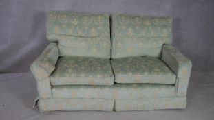 A floral upholstered two seater sofa. L.164.D.94.H.80cm
