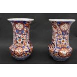 A pair of Meji period Japanese Imari ceramic vases. Decorated with floral and foliate motifs,