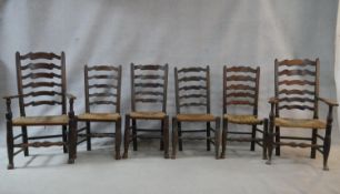 A matched set of six 19th century elm Lancashire ladderback dining chairs on turned stretchered