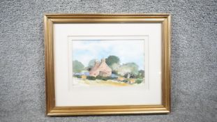David Birtwhistle - A framed and glazed watercolour on paper of a landscape with cottage. Signed