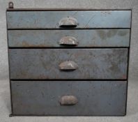 A vintage metal industrial style bank of drawers. H.49 W.58 D.28cm