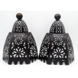 A pair of pierced metal geometric design wall mounted lanterns. H.43cm