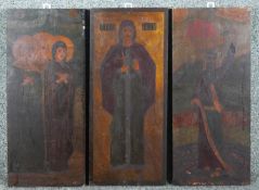 A triptych of painted religious icons on wood panel, with gilded details. H.47 W.20cm