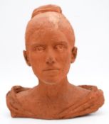 A sculpted terracotta bust of a female figure in evening dress. Monogrammed. H.38cm