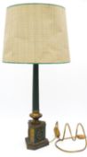 A vintage gilt metal and painted table lamp raised on fluted Classical column on decorative socle