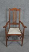 A C.1900 oak Arts and Crafts style armchair. H.110cm