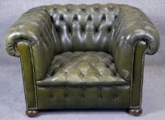 A Chesterfield armchair with leather buttoned upholstery to the seat and back. H.76cm