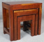 A nest of three hardwood graduating occasional tables. H.46cm