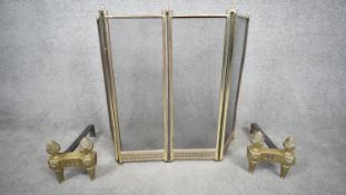 A pair of Victorian acanthus design solid brass fire dogs along with a pierced design mesh brass
