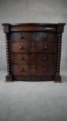 A Victorian mahogany bowfronted chest of two short above three long drawers flanked by bobbin turned