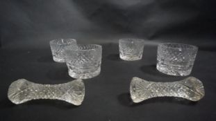 Four cut lead crystal candle holders and two Victorian cut glass knife rests. H.6cm