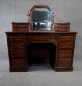 A 19th century Continental walnut, ebonised and inlaid dressing table with bevelled swing mirror