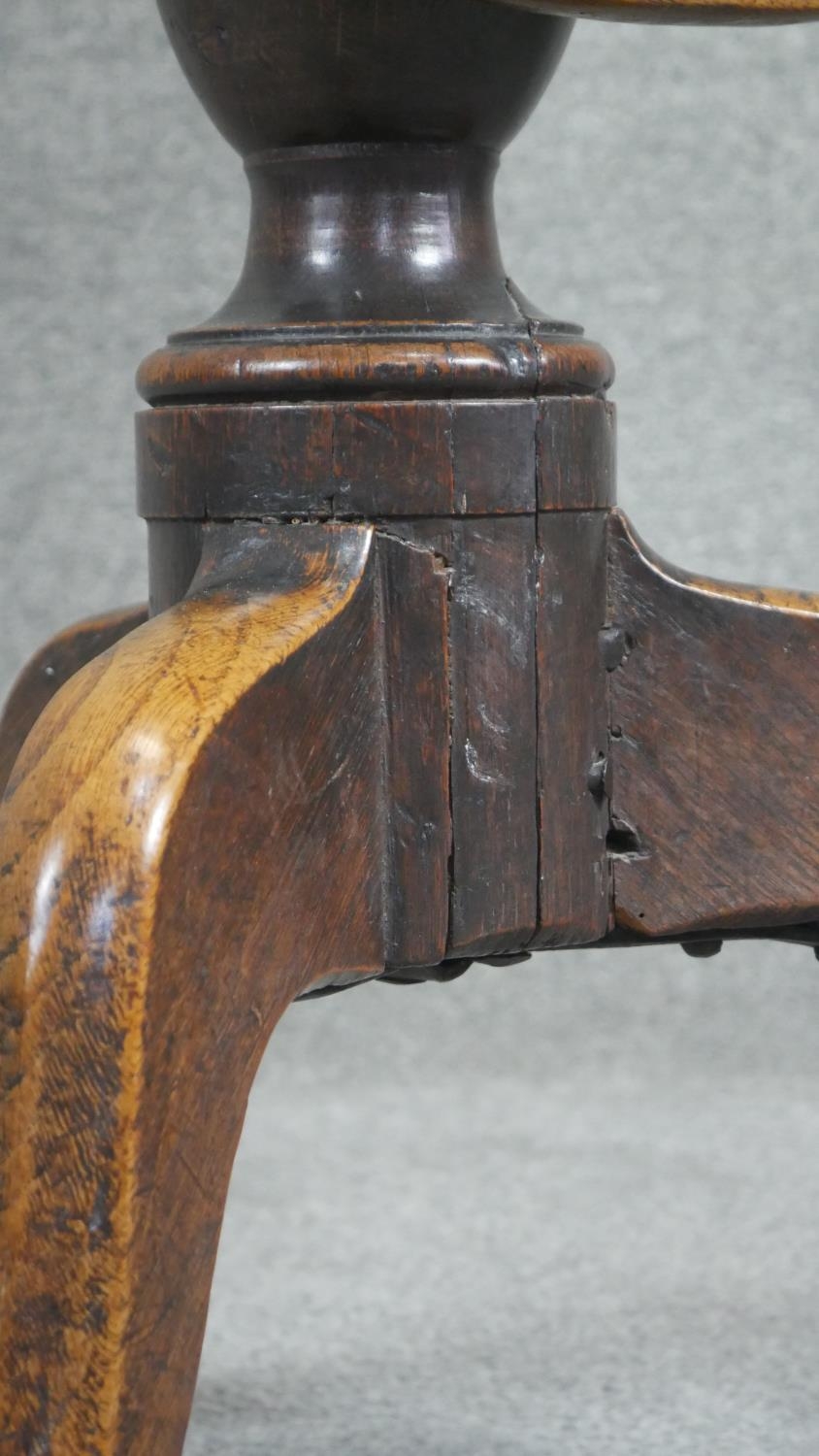 A Georgian oak tilt top table on baluster pedestal tripod supports. H.75cm (top in need of some - Image 3 of 4
