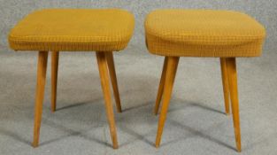 A pair of vintage Eastern European footstools in original upholstery on splay beech supports with