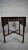 A Georgian style mahogany Pembroke table in the Chinese Chippendale manner. H.70 W.61 D.64 Ex.110