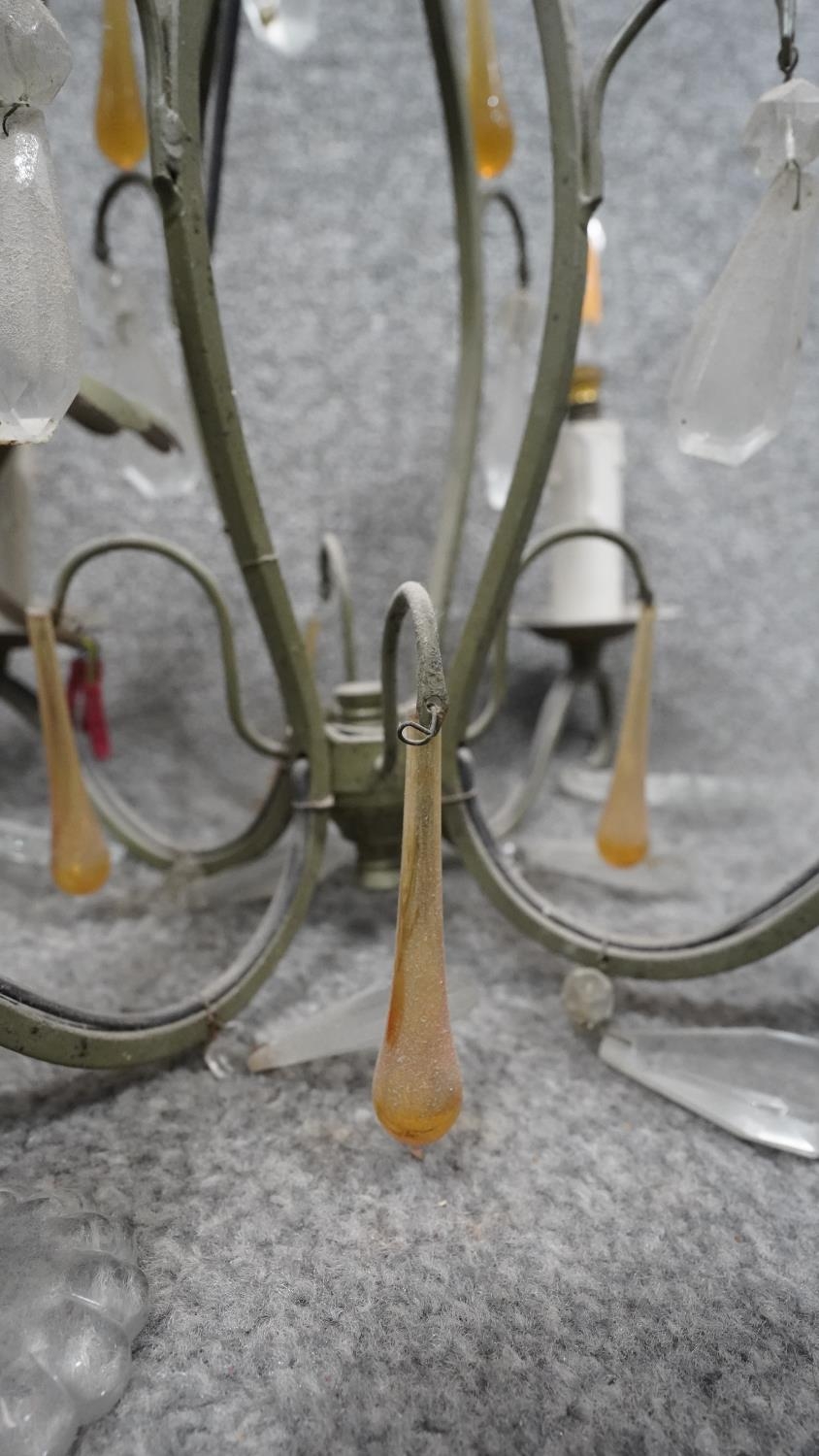 A green painted scrolling design four branch chandelier with clear and amber glass drops. D.34cm - Image 4 of 5