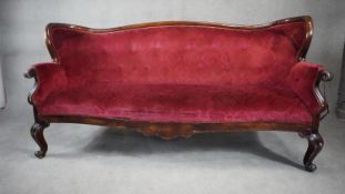 A late 19th century stained birch framed sofa in cut floral upholstery on cabriole supports. H.105