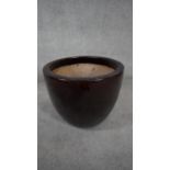 A large brown saltglaze ceramic planter. H.46 W.57cm