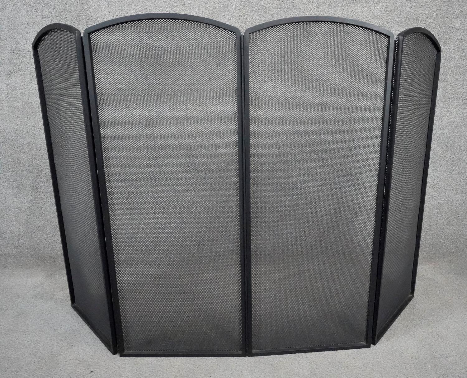 A metal four panel fire screen. H.77 W.107cm