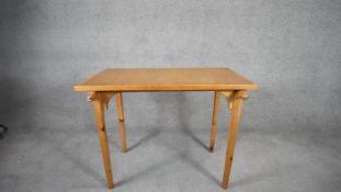 An oak and pine centre table with carved animal masks to each support. H.70cm