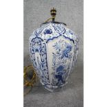 A ceramic bulbous form Majolica blue and white hand painted floral design table lamp with silk