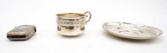 A novelty French silver tea cup and saucer along with an engraved vesta case. The tea cup and saucer