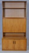 A vintage teak wall cabinet fitted with central secretaire section. H.199 W.100 D.46cm