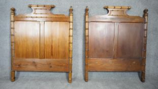 A pair of pitch pine faux bamboo style headboards for single beds. H.124 W.101 D.6cm