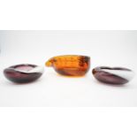 A collection of three vintage Murano style glass bowls. One in amber glass with a stylised leaf