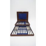 A 19th century mahogany cased part canteen of twelve John Gilbert dessert knives and forks. (one