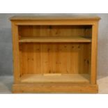 A Victorian style pine dwarf open bookcase. H.87 W.101 D.37cm