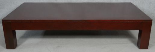 A large contemporary coffee table on block supports. H.41.5 L.182 W.92cm