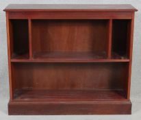 A contemporary mahogany open bookcase on plinth base. H.83 W.96.5 D.25cm